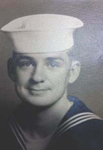 Vintage sailor portrait wearing white hat