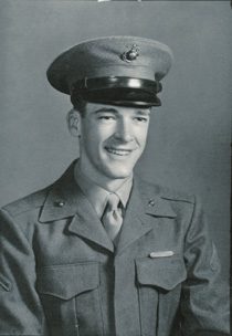 Young man in vintage military uniform smiling