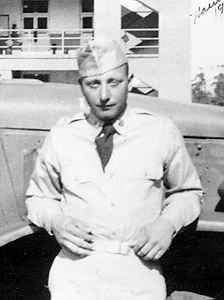 Man wearing military cap by vintage car