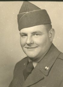 Smiling serviceman in vintage military uniform