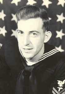 Young Navy sailor portrait with American flag