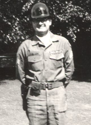 Soldier in vintage uniform standing outdoors
