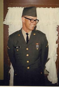 Smiling man in vintage U.S. Army uniform