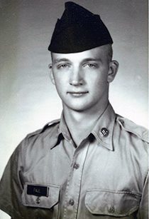 Vintage black-and-white portrait of young soldier