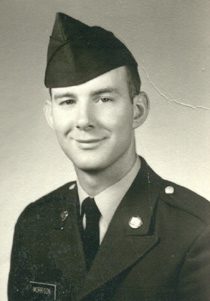 Portrait of young man in military uniform