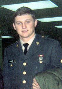 Young man in military dress uniform