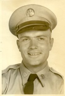 Smiling young soldier in vintage uniform