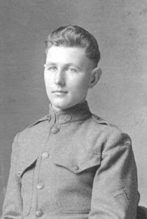 Black-and-white portrait of young soldier in uniform