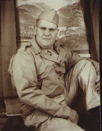 Vintage soldier wearing glasses seated before scenic backdrop