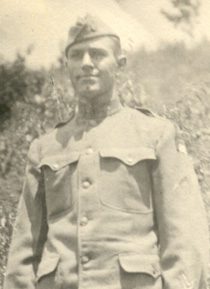 Sepia portrait of uniformed soldier outdoors
