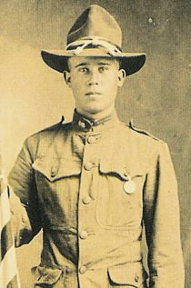 Young soldier in vintage uniform and hat